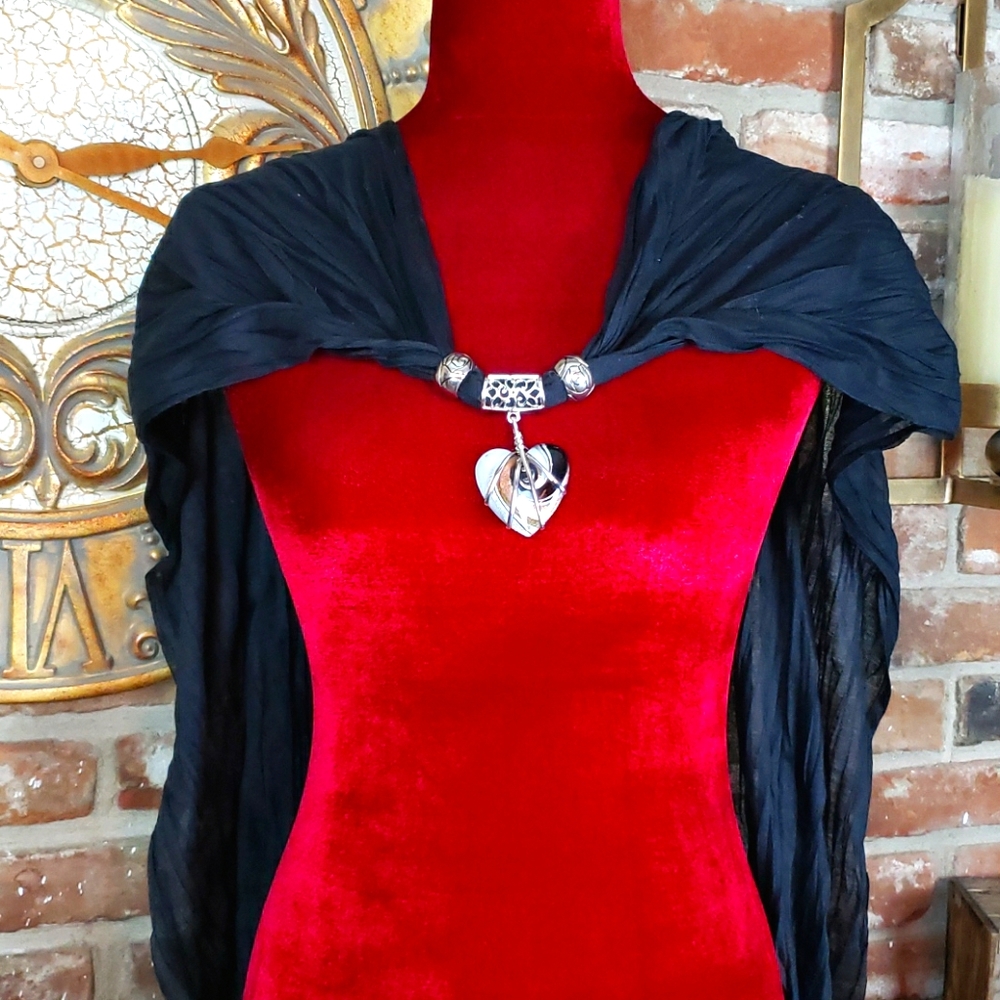 Lightweight scarf w/ heart embellishment.